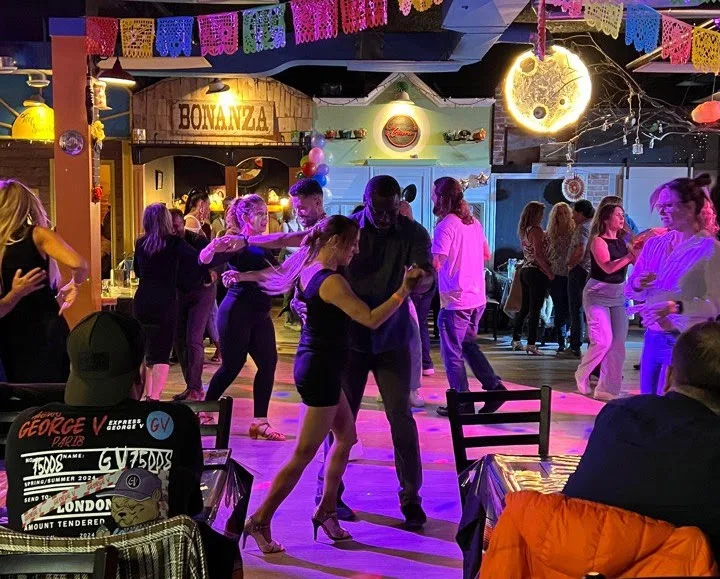 Guests dancing at a Latin night at Tenoch